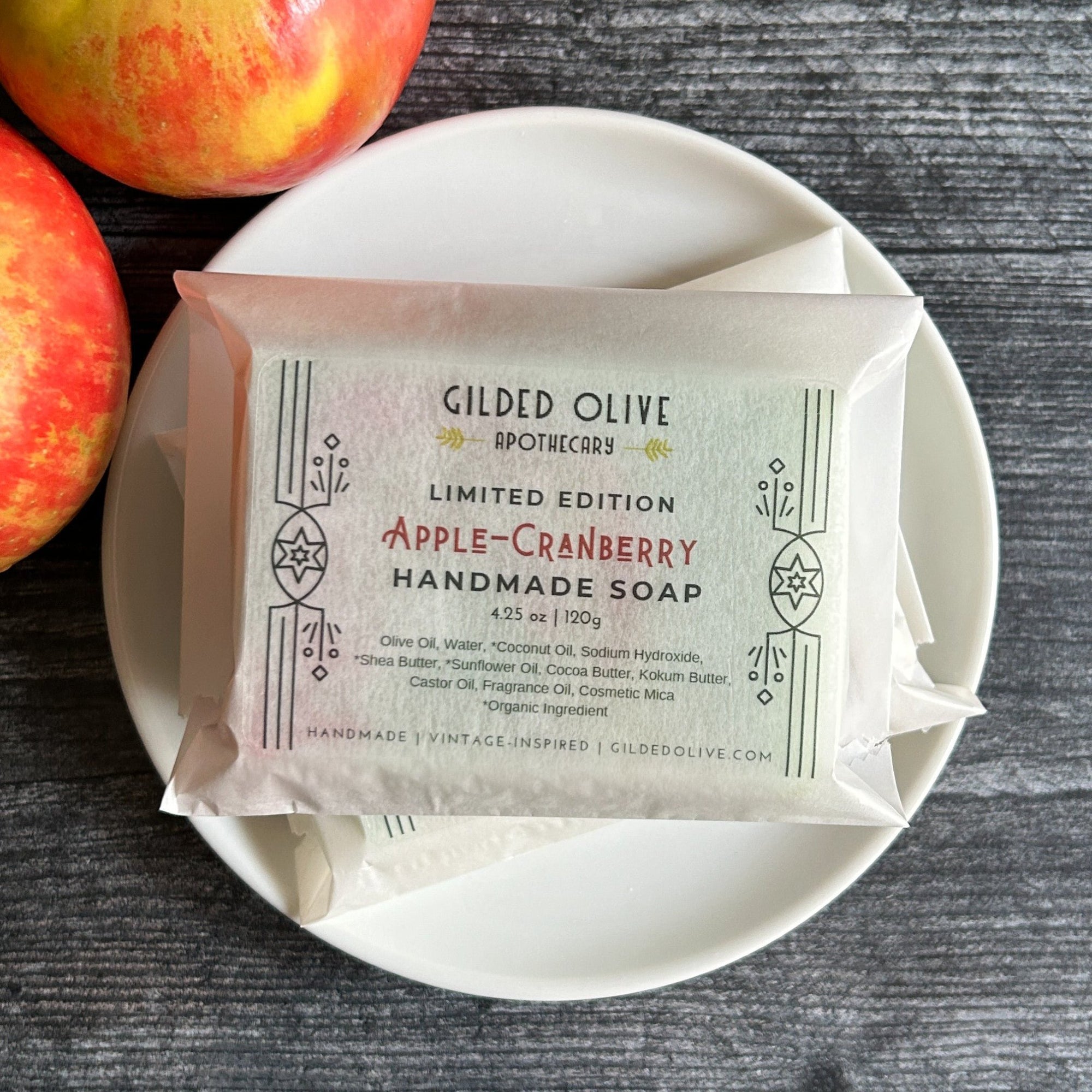 Apple Cranberry Soap, packaged on a white soap dish