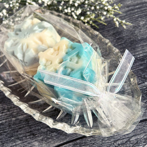 Snowflake Soaps, packaged in a clear cello bag with ribbon