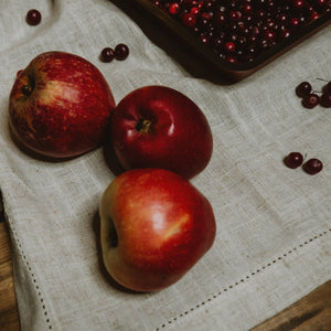 Apples & Cranberries on a linen table cloth